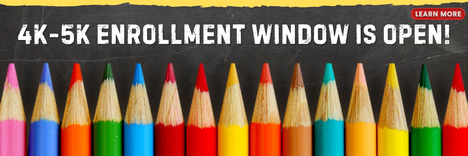 Blackboard with a row of colored pencils.