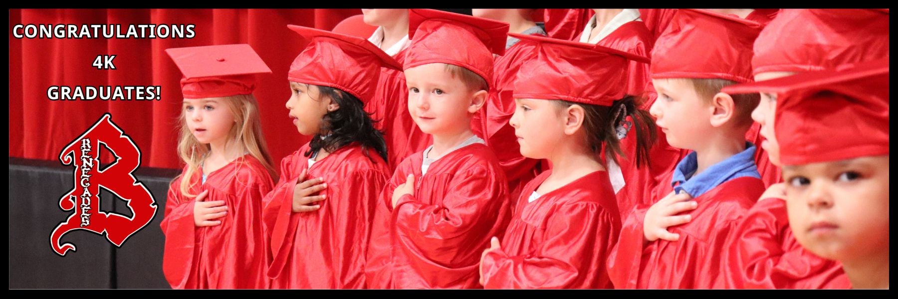4K students in red graduation gowns